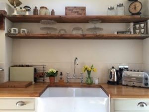 Kitchen shelves made from reclaimed scaffold boards