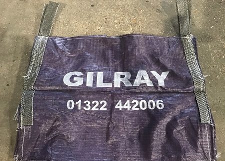 A Gilray Plant branded rubble sack with handles flat on the floor